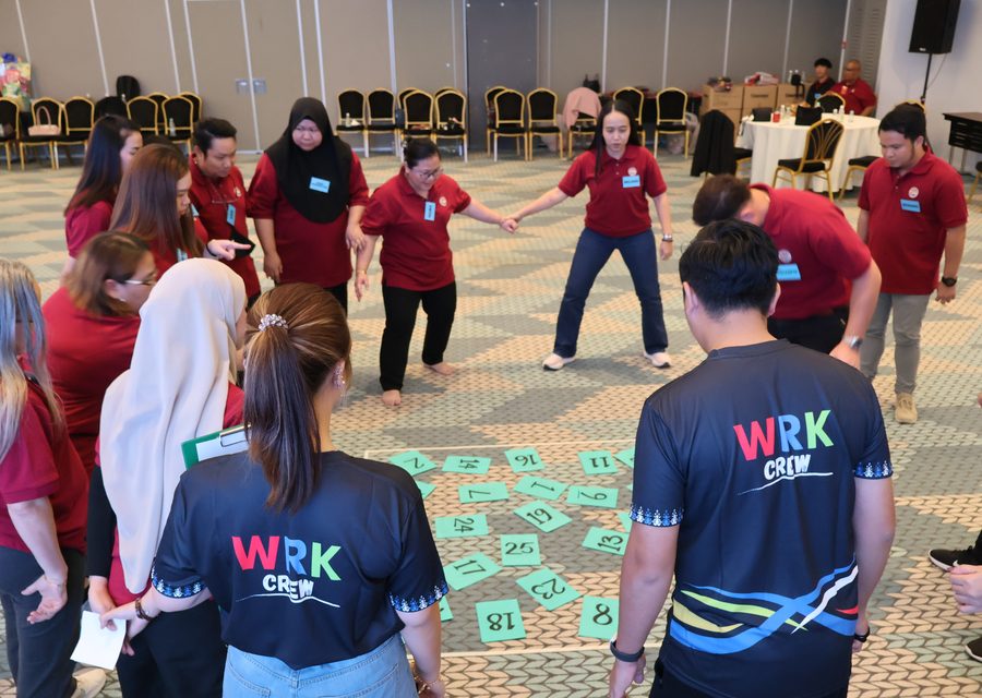 WRK team-building participants collaborating in an experiential activity
